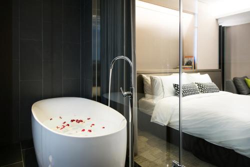 Voodi või voodid majutusasutuse Hotel Reve Taichung toas