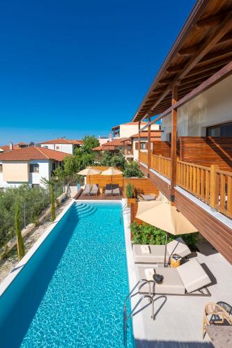 an overhead view of a swimming pool in a house at Anima Residence in Nea Roda