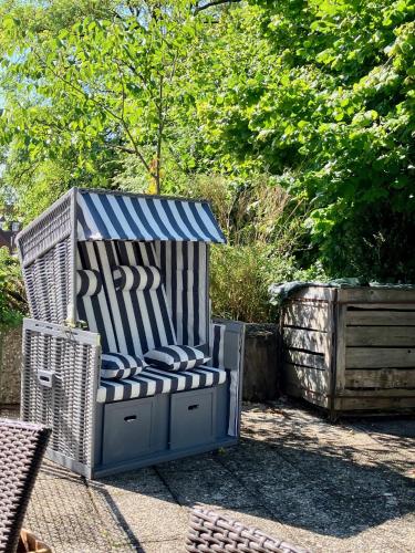 a blue and white chair sitting on a patio at Altbau-Traum mit Riesen-Dachterrasse in Moosburg