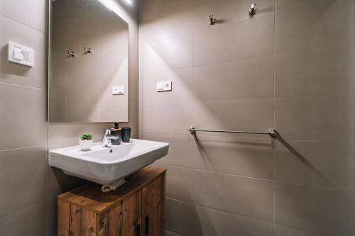 a bathroom with a sink and a mirror at AH Radnica Luxury Spa in Košice