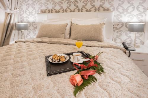 Ένα ή περισσότερα κρεβάτια σε δωμάτιο στο Sultan Modern Hotel