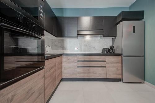 Urban Square Elite Residences by 360 Estatesにあるキッチンまたは簡易キッチン