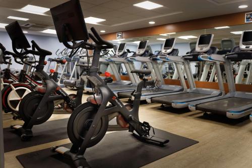 a gym with a bunch of tread machines at Hilton Leicester Hotel in Leicester