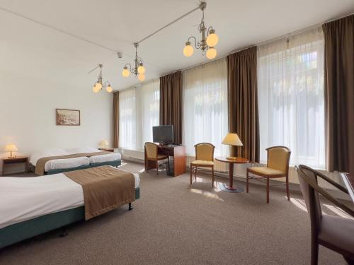 Postel nebo postele na pokoji v ubytování Hotel 't Spijker