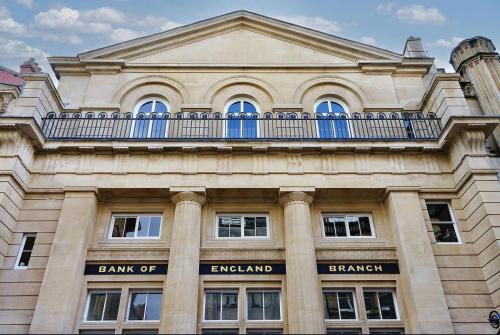 a building with a balcony on top of it at The Sovereign Suite - 2 Bedroom Apartment in Central Bristol by Mint Stays in Bristol