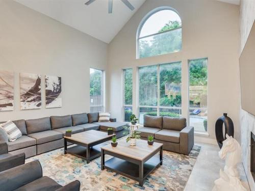 a living room with a couch and a table at Captivating 6BR 3BA Holiday Home with Pool & Fire Pit in Mesquite