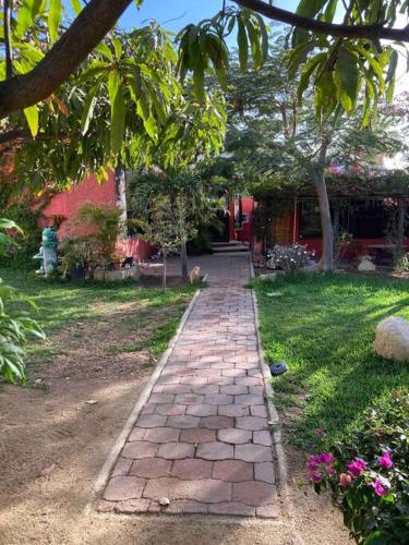 a brick path in front of a house at Bungalow And Surf in Cabo San Lucas