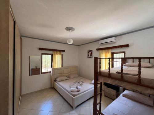 Postel nebo postele na pokoji v ubytování Oni Apartments