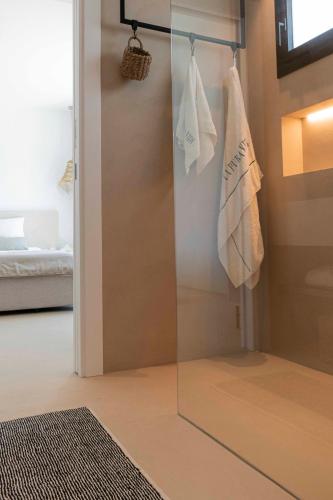 a sliding glass door in a room with a bedroom at La Villa Pura Vida San Diego - Luxury Villa with Wonderful Sea View - Direct walking access to beach! 5 min from Sotogrande in San Roque