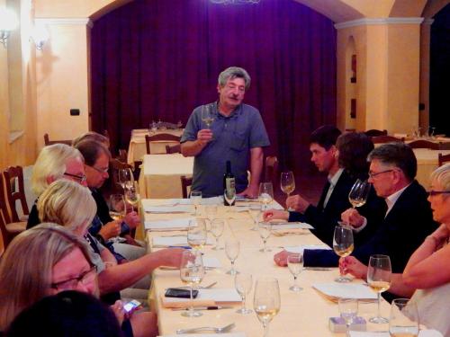 a group of people sitting around a table with wine glasses at Tenuta Montelaura in Forino