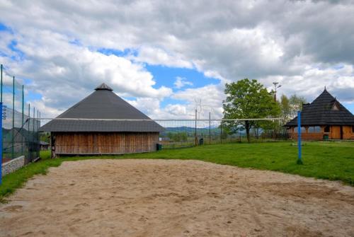 two barns and a soccer field with at Ośrodek Wczasowy Groń Placówka in Groń
