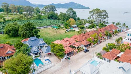 an aerial view of a row of houses at About A Beach Pool Villa Bangsaray in Bang Sare