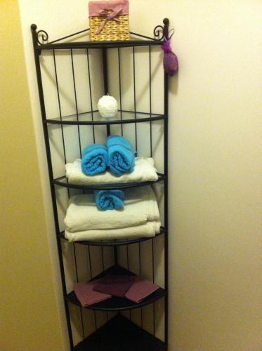 a towel rack with towels and towels at Casa Vacanze Orchidea CIR0347AT00249 in Parma