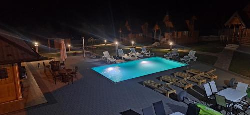 an overhead view of a swimming pool at night at Suncev Brijeg in Banja Luka