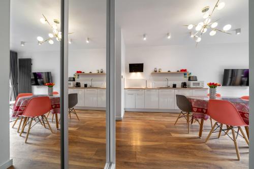 a kitchen and dining room with a table and chairs at WILLA JAROSTA & SPA, AC -free parking in Zakopane