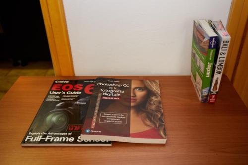 a magazine sitting on top of a wooden table at Rustico in borgo Polcenigo in Polcenigo