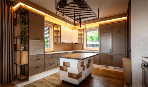 a kitchen with a large island in the middle at Hillmax Residence in Sarajevo
