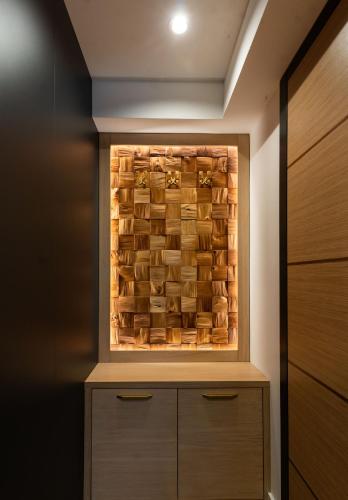 a walk in closet with a wooden wall at Hillmax Residence in Sarajevo