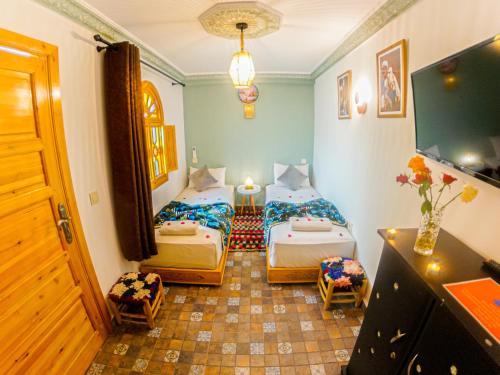 Postel nebo postele na pokoji v ubytování Riad Dar Yassine