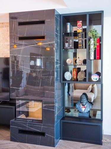 a glass display case with a statue in a room at Villa River in Mostar