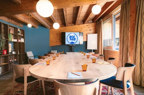 a large conference room with a large table and chairs at Big Sky Hotel & Spa in Chamonix-Mont-Blanc