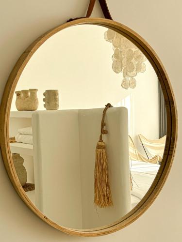 a mirror hanging on a wall in a room at Villa Le Belvedere in Tangier