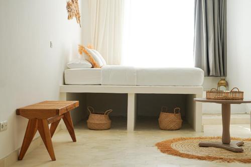 a white couch sitting in a room with a window at Villa Le Belvedere in Tangier
