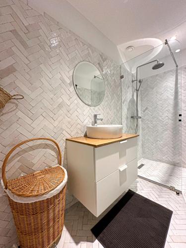a bathroom with a sink and a mirror at Villa Le Belvedere in Tangier