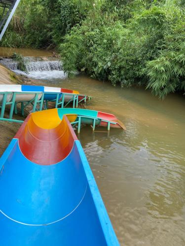 a group of colorful slides in a river at Gạo hạt dẻ homestay in Bao Loc
