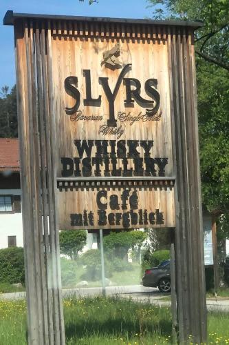 a sign for a skys mayhem car dealership at SeelenbaumlerIn in Schliersee