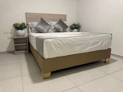 Postel nebo postele na pokoji v ubytování Hotel Med Llanogrande