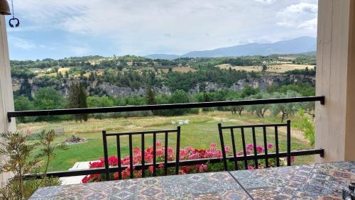 a balcony with a view of a field of flowers at Villa Vista Monti in Bolognano