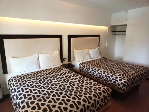 Кровать или кровати в номере Hotel Essen's