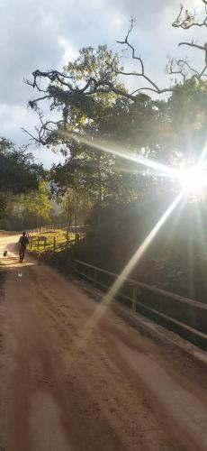 a person riding a horse on a dirt road at Sitio Alecrim Gastronomia e Hospedaria in Alagoa