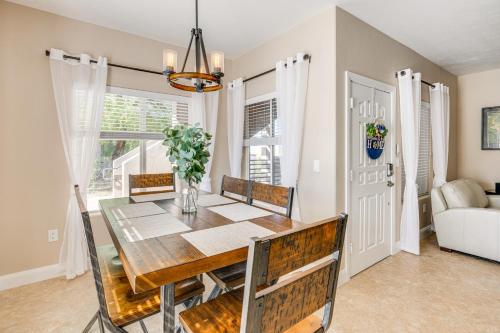 a dining room with a wooden table and chairs at Mesquite Apartment Walk to Wolf Creek Golf Club! in Mesquite