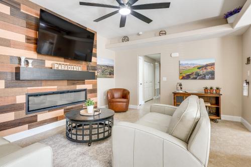 a living room with a fireplace and a tv at Mesquite Apartment Walk to Wolf Creek Golf Club! in Mesquite