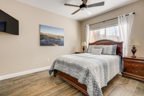 a bedroom with a bed and a ceiling fan at Mesquite Apartment Walk to Wolf Creek Golf Club! in Mesquite