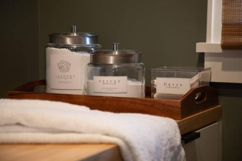 three candles on a wooden shelf with a towel at Spacious 3B2B Minutes to Skyline in Waynesboro