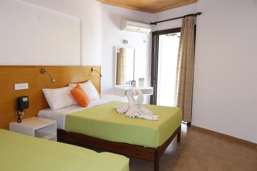 Postel nebo postele na pokoji v ubytování Valais Hotel