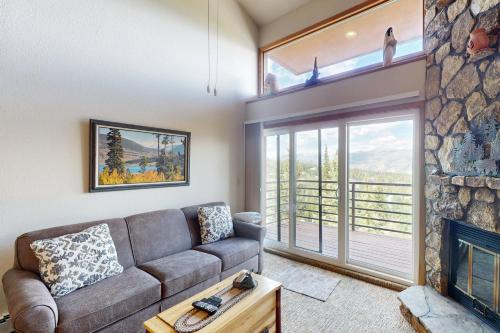 a living room with a couch and a fireplace at Buffalo Village 402 in Silverthorne