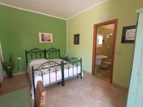 Postel nebo postele na pokoji v ubytování B&B Uliveto del Gargano