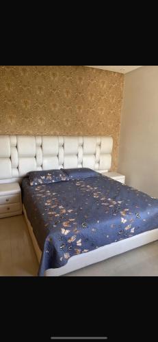 Ένα ή περισσότερα κρεβάτια σε δωμάτιο στο Bel appartement avec piscine vu sur mer