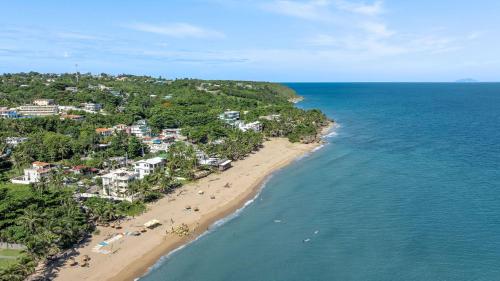 an aerial view of a beach and the ocean at Sandy Beach Villa - Spectacular setting on the beach (full service generator) in Rincon
