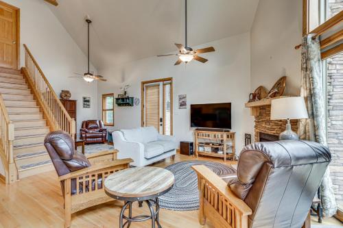 a living room with a couch chairs and a tv at Peeking Pines A-Frame Cabin in Bryce Resort! in Basye