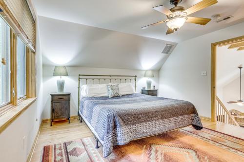 a bedroom with a bed and a ceiling fan at Peeking Pines A-Frame Cabin in Bryce Resort! in Basye