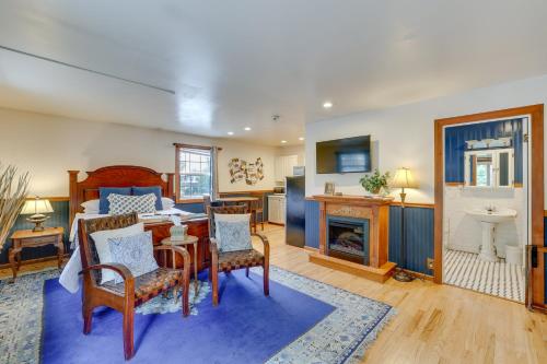 a living room with a bed and a dining room at Historic Boise Studio with Courtyard, Blocks to Dtwn in Boise