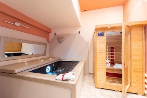 a jacuzzi tub in the corner of a room at Terre Dell'Amore in Grosseto