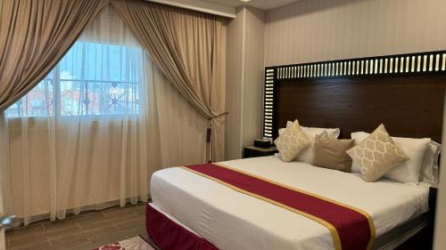 Letto o letti in una camera di شقق ساسو سويت للشقق المخدومة