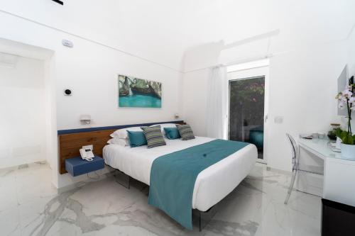 Ένα ή περισσότερα κρεβάτια σε δωμάτιο στο Villa L'Ara