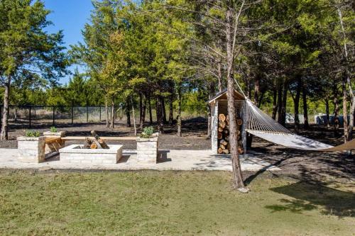 a playground with a hammock in a park at Paradise Tiger Mansion 6BR W Pool, Weddings Events in Waxahachie